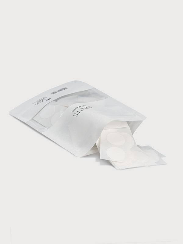 Packung mit 50 transparenten Ellen Wille Klebepunkten für diskrete Befestigung von Haarprothesen auf Monofilament