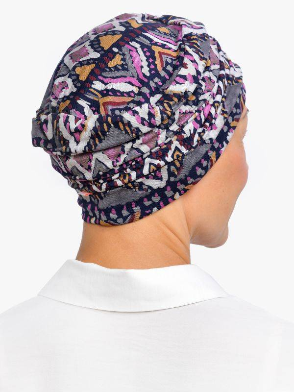 Chemo-Mütze Marlene Printed Rosette La Vedette aus Viskose, nahtlos, Volumeneffekt, sanft für empfindliche Kopfhaut