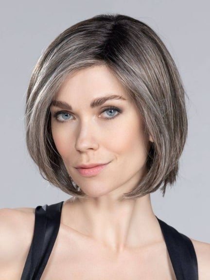 Elite Mono Part Perücke mit glatten mittellangen Haaren und variablem Pony