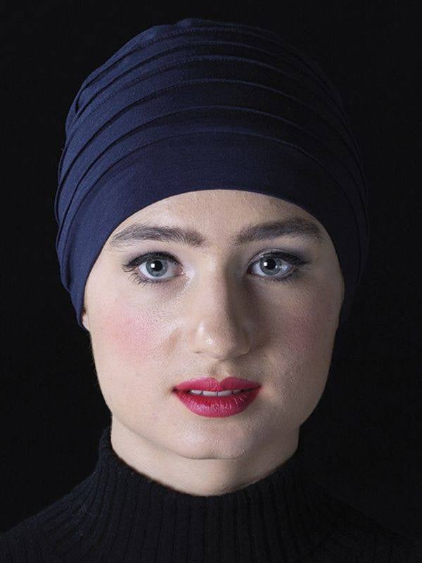Turban Lola MMParis aus Bambusfaser, gefaltet, weich und atmungsaktiv, komfortables Accessoire für einen femininen Stil